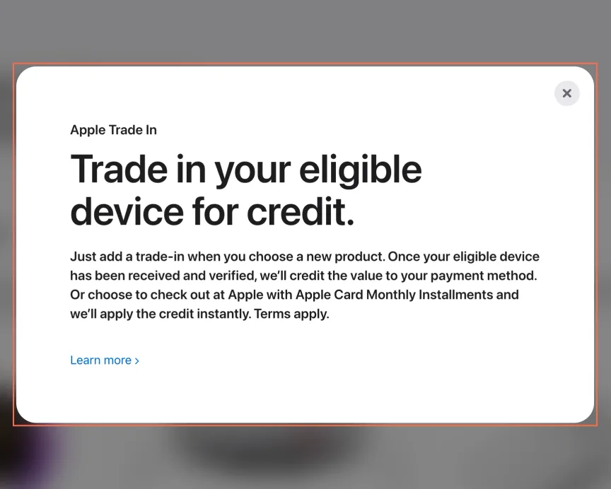 apple.com at desktop size, the frame on what this finding is about: The Trade In panel’s close button is named ‘Learn more, Apple Trade In’.